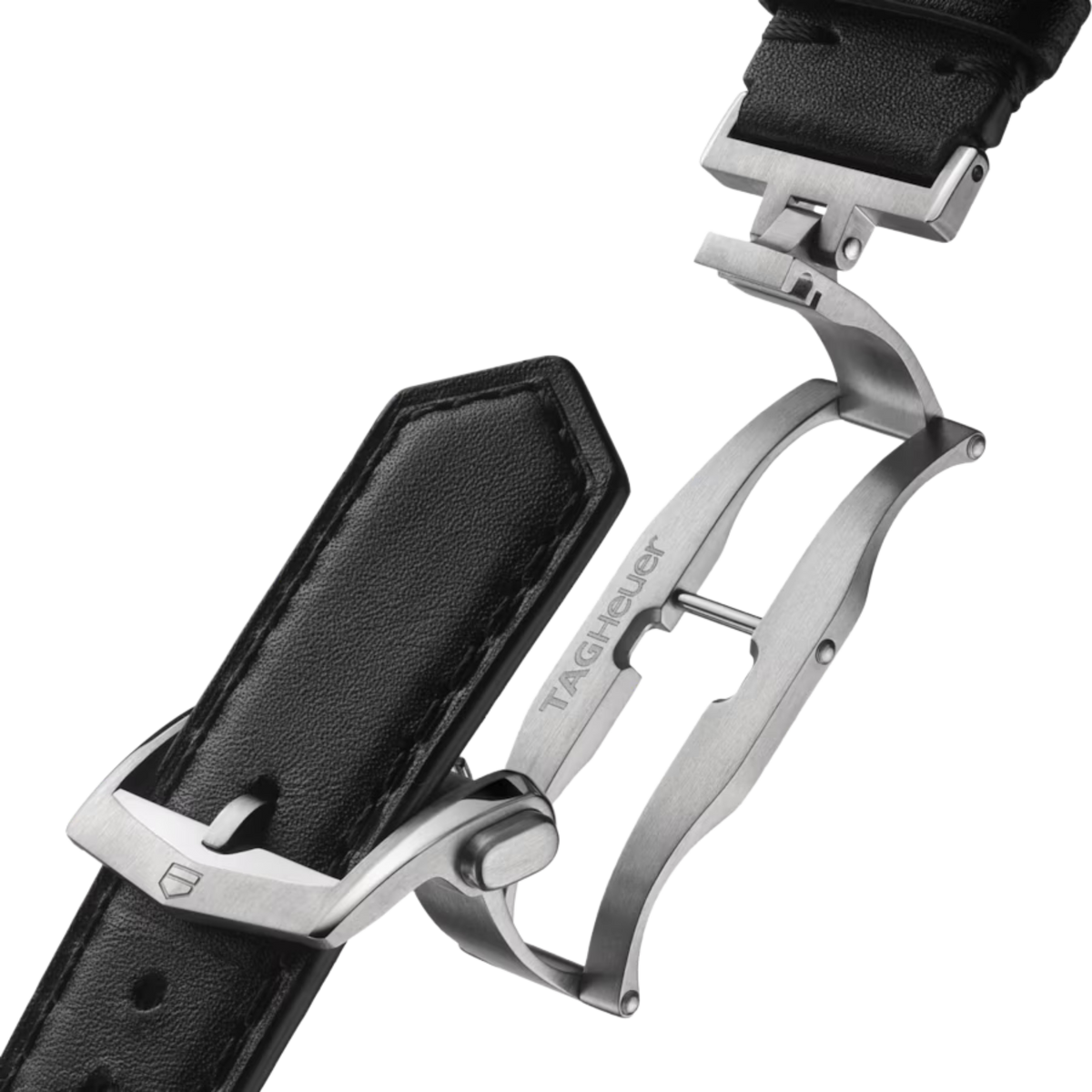 Close-up of the TAG Heuer folding clasp and black perforated leather strap with brushed stainless steel deployment buckle