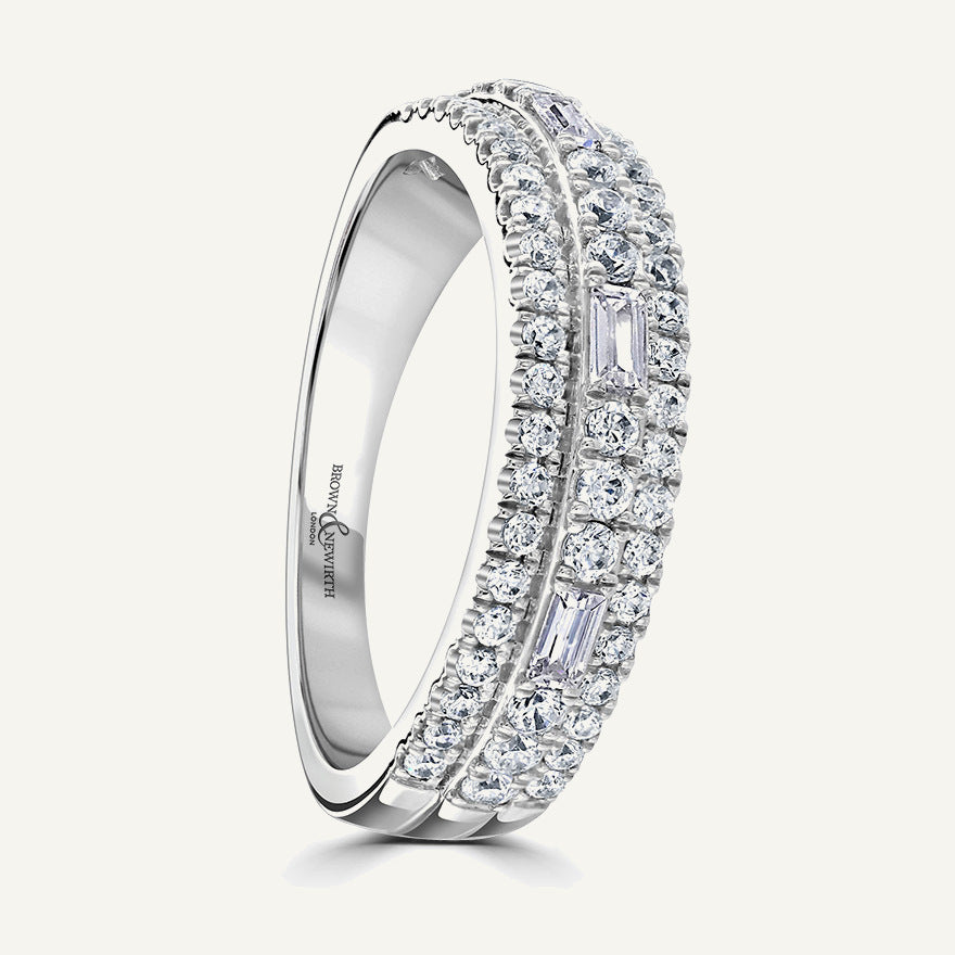 Elevated Round And Baguette Centre, Round Edge Three Row Split Claw Diamond Eternity Ring
