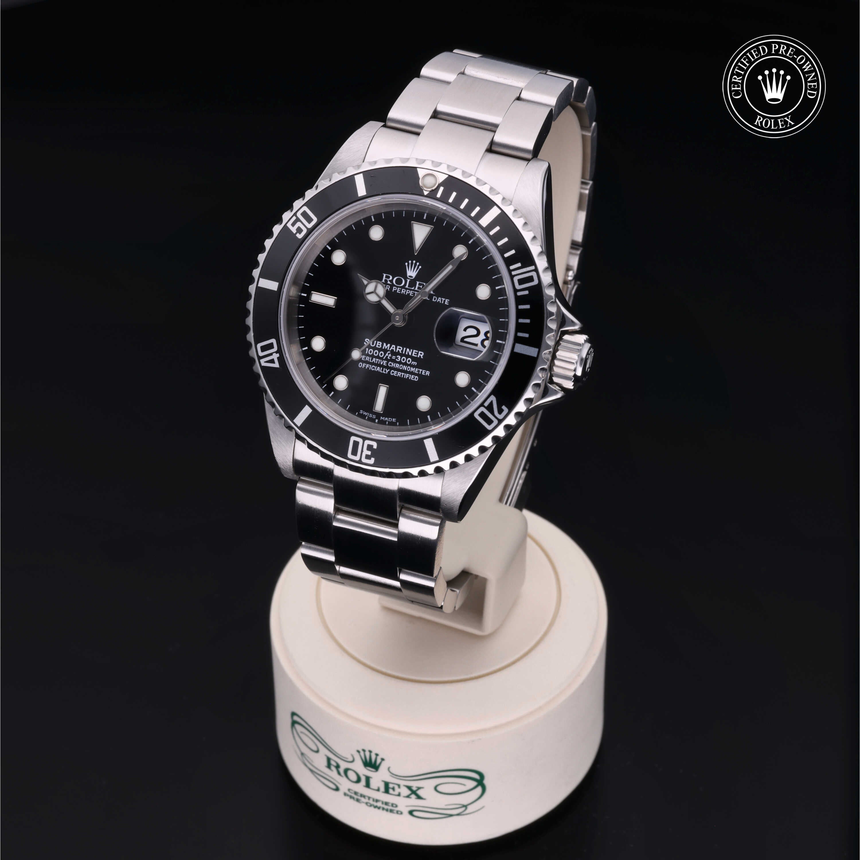 Rolex Submariner Date 2003 model showcasing a 40mm Oystersteel case, striking black dial and iconic Rolex professional diving watch design.
