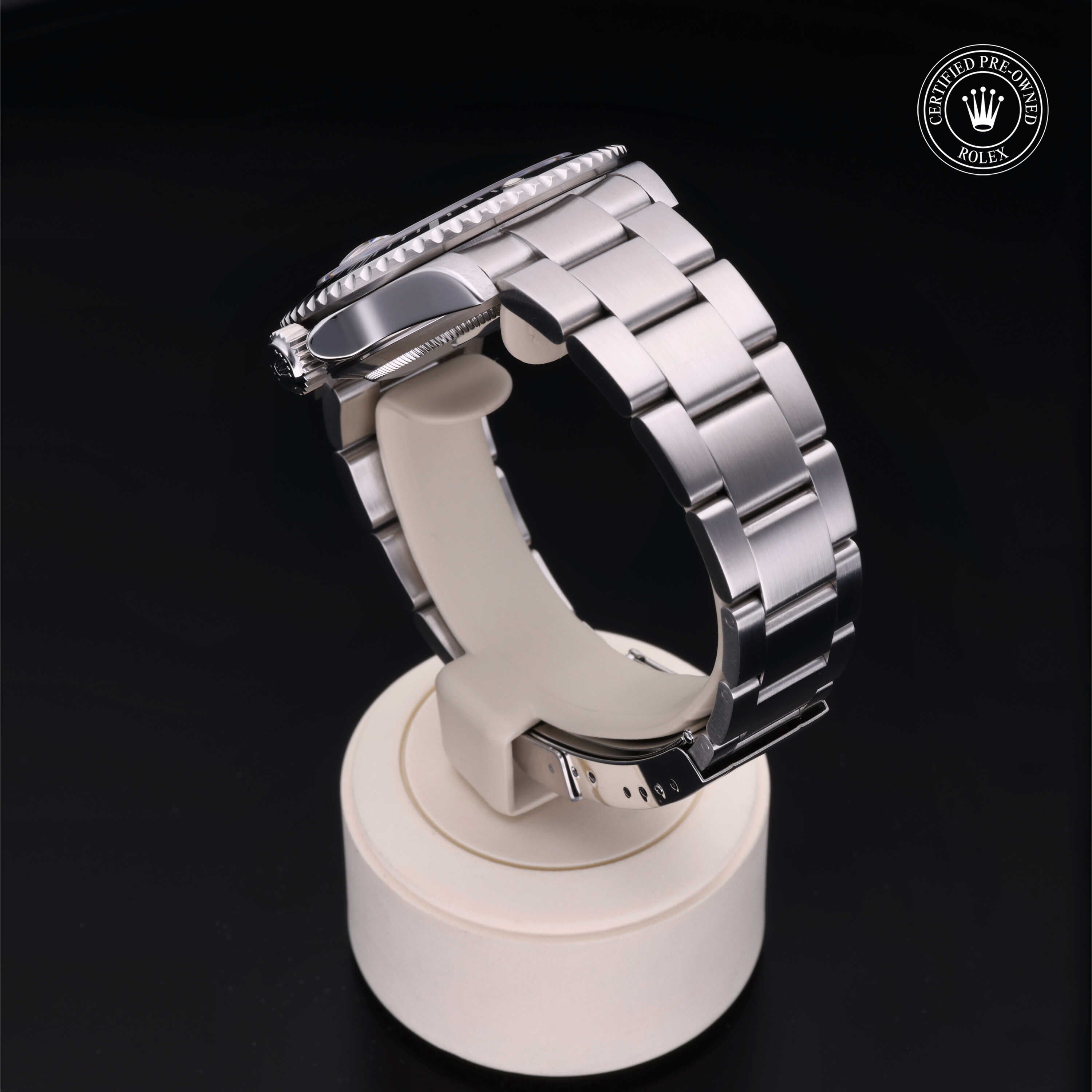 Pre-owned Rolex Submariner Date 40mm from 2003, featuring a black dial, stainless steel Oyster bracelet and original Rolex box and papers.
