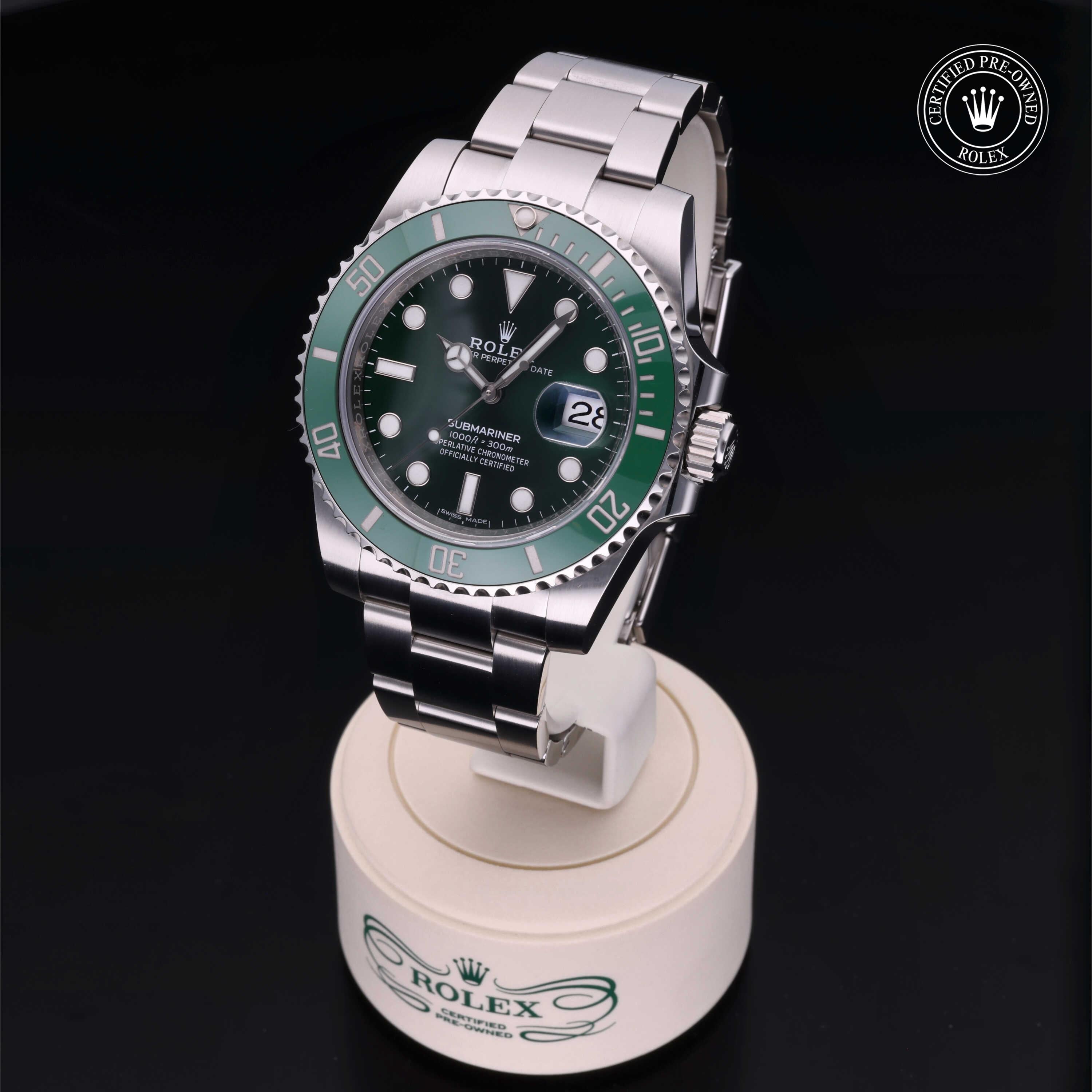 2018 Rolex Submariner Date luxury automatic diving watch featuring a distinctive green dial and stainless steel construction