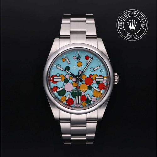 Rolex Certified Pre-Owned Oyster Perpetual 41mm in Oystersteel, featuring a vibrant turquoise blue Celebration motif dial, smooth domed bezel and Oyster bracelet.