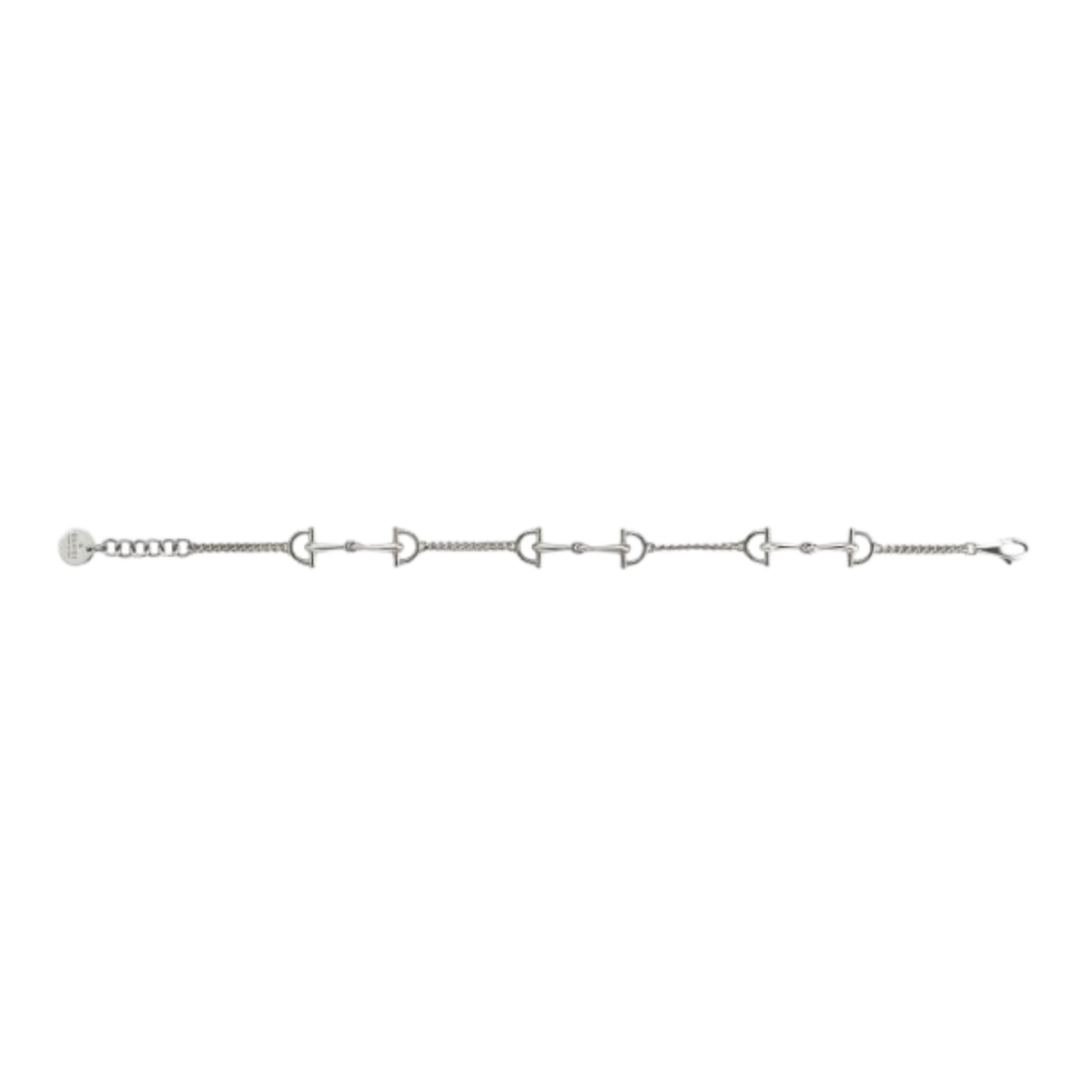 Full-length view of the Gucci Staffa sterling silver bracelet displaying five flexible stirrup-inspired links, fine chain construction, adjustable clasp, and Gucci logo charm.