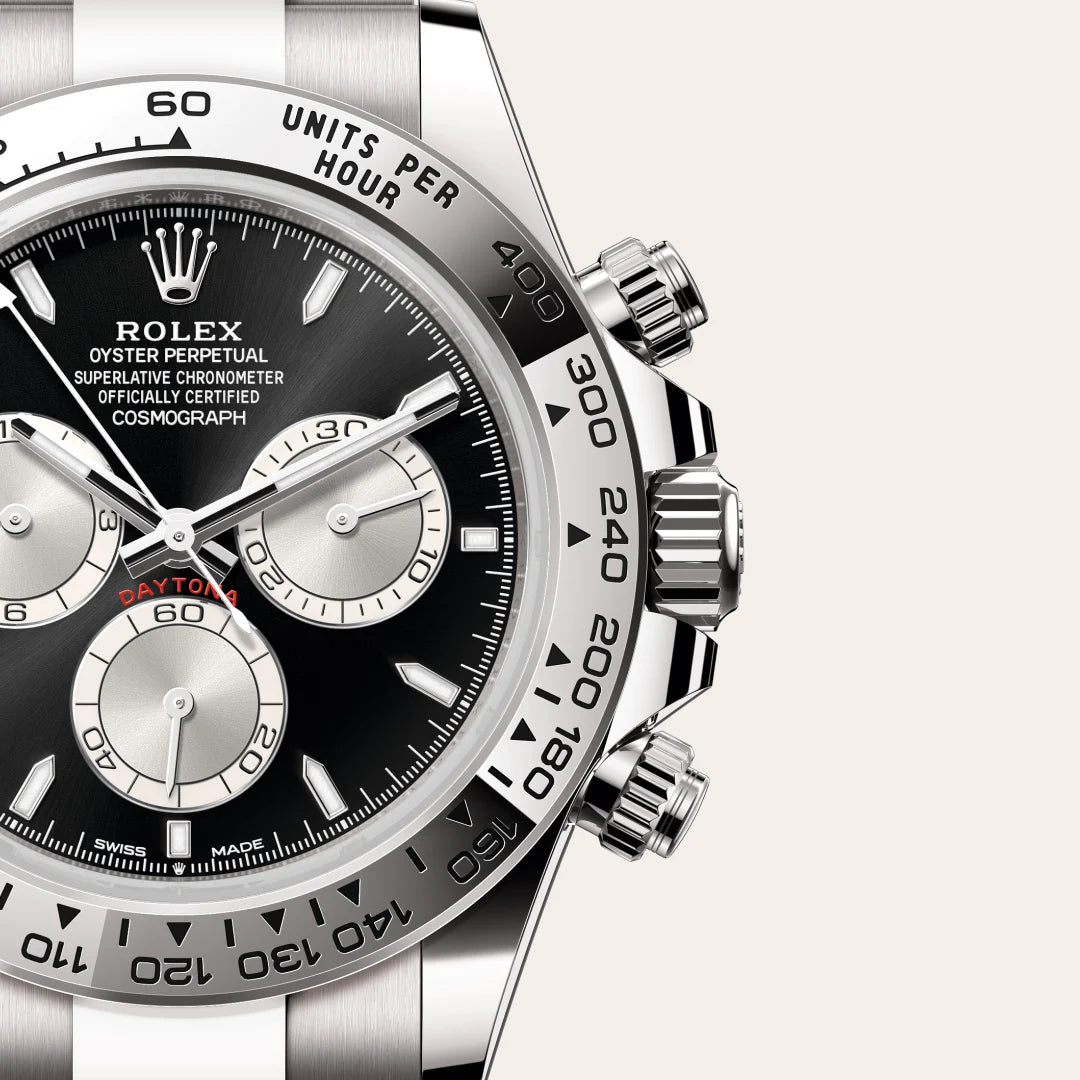 Rolex Cosmograph Daytona in 18 ct white gold with a Bright black and steel dial, Fixed, with engraved tachymetric scale, in 18 ct white gold bezel, Oyster, three-piece solid links bracelet