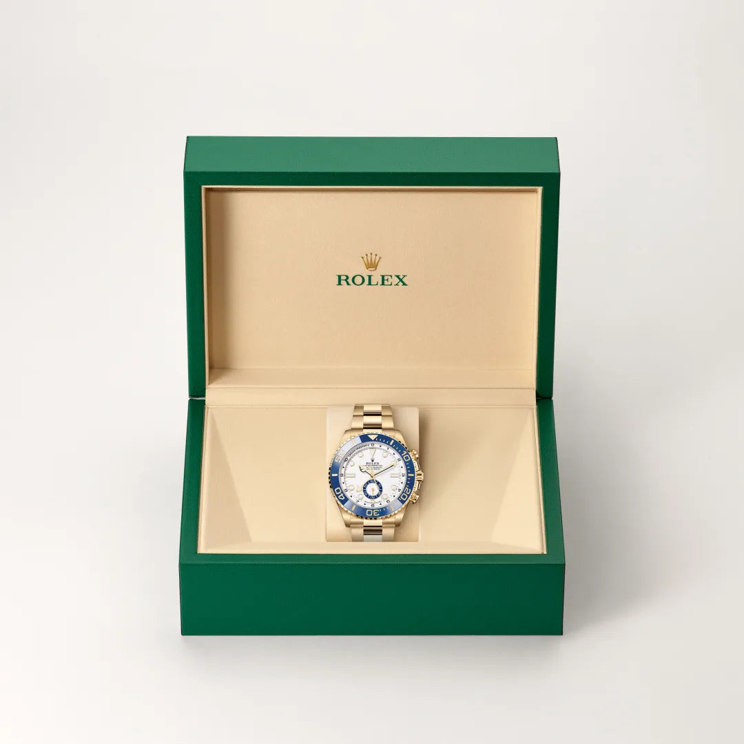 Rolex Yacht-Master II in 18 ct yellow gold with a White dial, Bidirectional rotatable 60-minute graduated bezel with blue Cerachrom insert in ceramic. Moulded, recessed graduations and numerals coated with gold bezel, Oyster, three-piece solid links bracelet