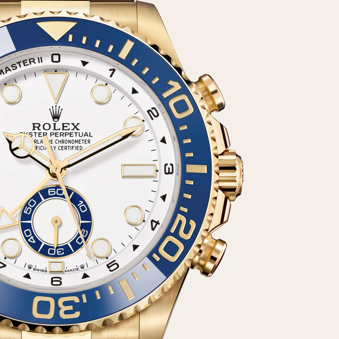 Rolex Yacht-Master II in 18 ct yellow gold with a White dial, Bidirectional rotatable 60-minute graduated bezel with blue Cerachrom insert in ceramic. Moulded, recessed graduations and numerals coated with gold bezel, Oyster, three-piece solid links bracelet