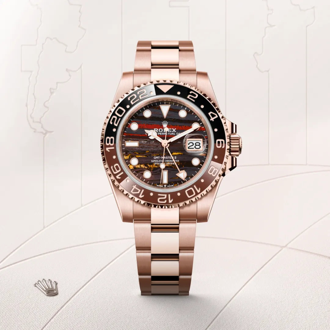 Rolex GMT-Master II in 18 ct Everose gold with a Tiger iron dial, Bidirectional rotatable 24-hour graduated bezel. Two-colour brown and black Cerachrom insert in ceramic, moulded numerals and graduations bezel, Oyster, three-piece solid links bracelet