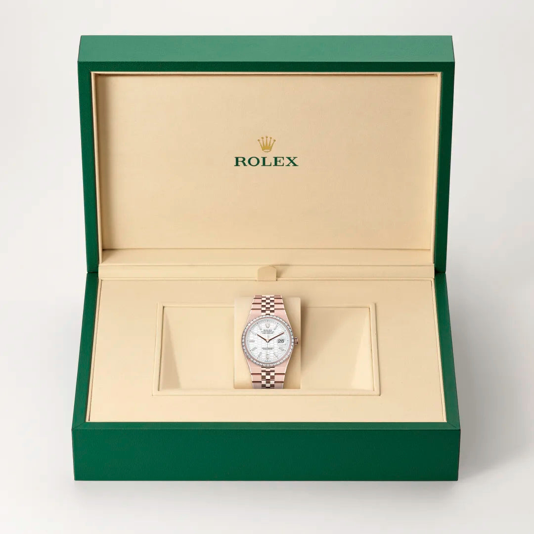 Rolex Land-Dweller 36 in 18 ct Everose gold with a Intense white, honeycomb motif set with diamonds dial, Set with diamonds bezel, Flat Jubilee, five-piece solid links bracelet