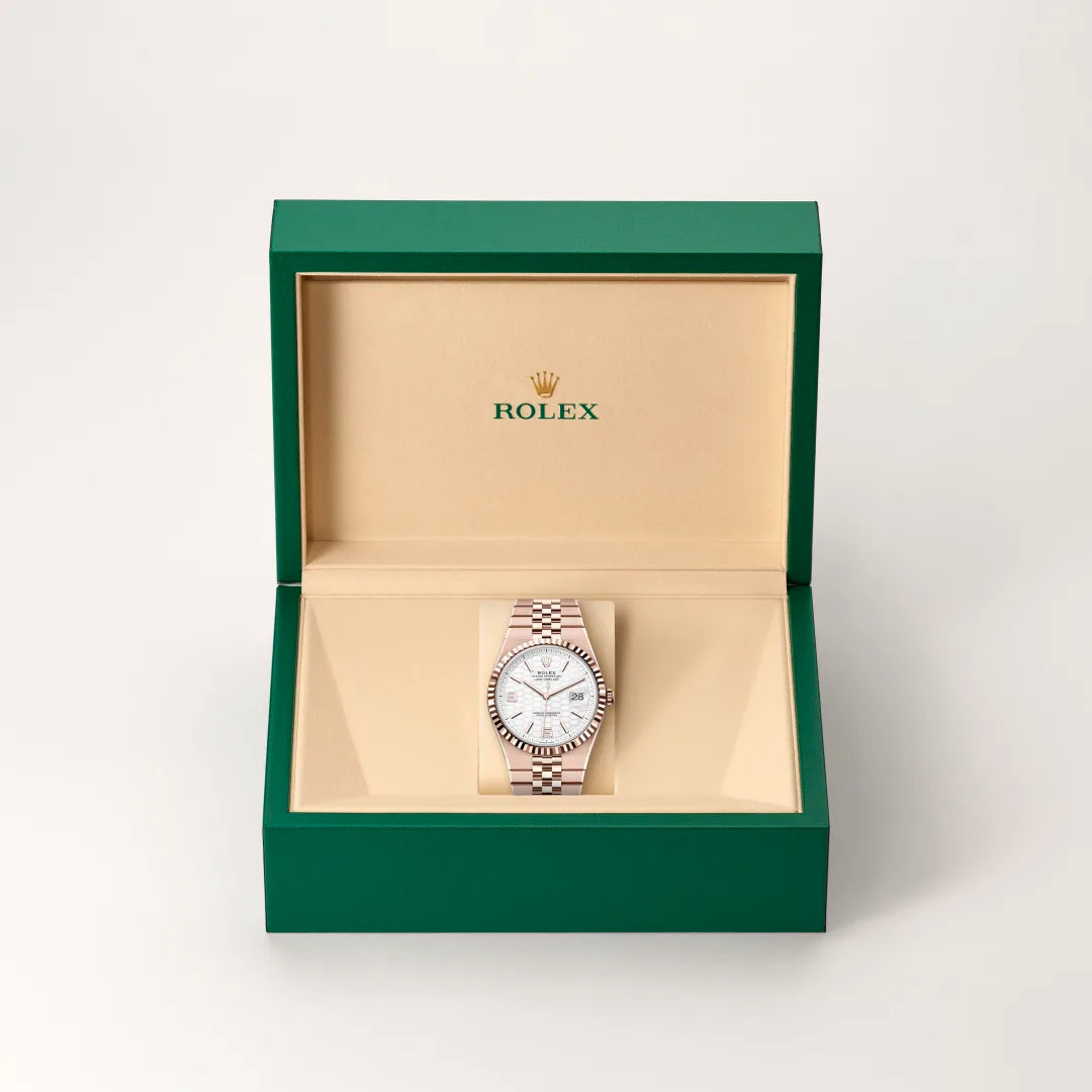 Rolex Land-Dweller 40 in 18 ct Everose gold with a Intense white, honeycomb motif dial, Fluted bezel, Flat Jubilee, five-piece solid links bracelet