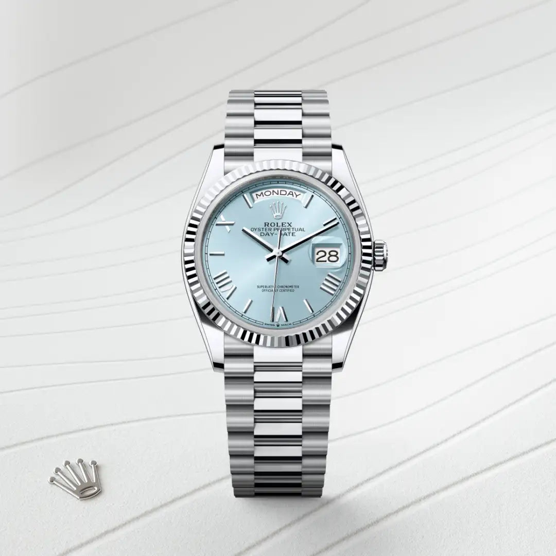 Rolex Day-Date 36 in Platinum with a Ice blue dial, Fluted bezel, President, semi-circular three-piece links bracelet