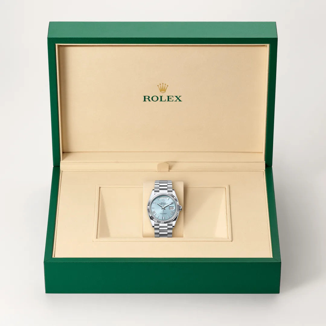 Rolex Day-Date 36 in Platinum with a Ice blue dial, Fluted bezel, President, semi-circular three-piece links bracelet