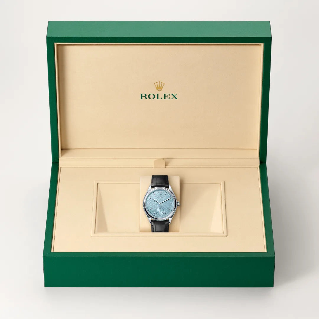 Rolex 1908 in Platinum with a Ice blue, rice-grain motif dial, Domed and fluted bezel, Leather strap bracelet