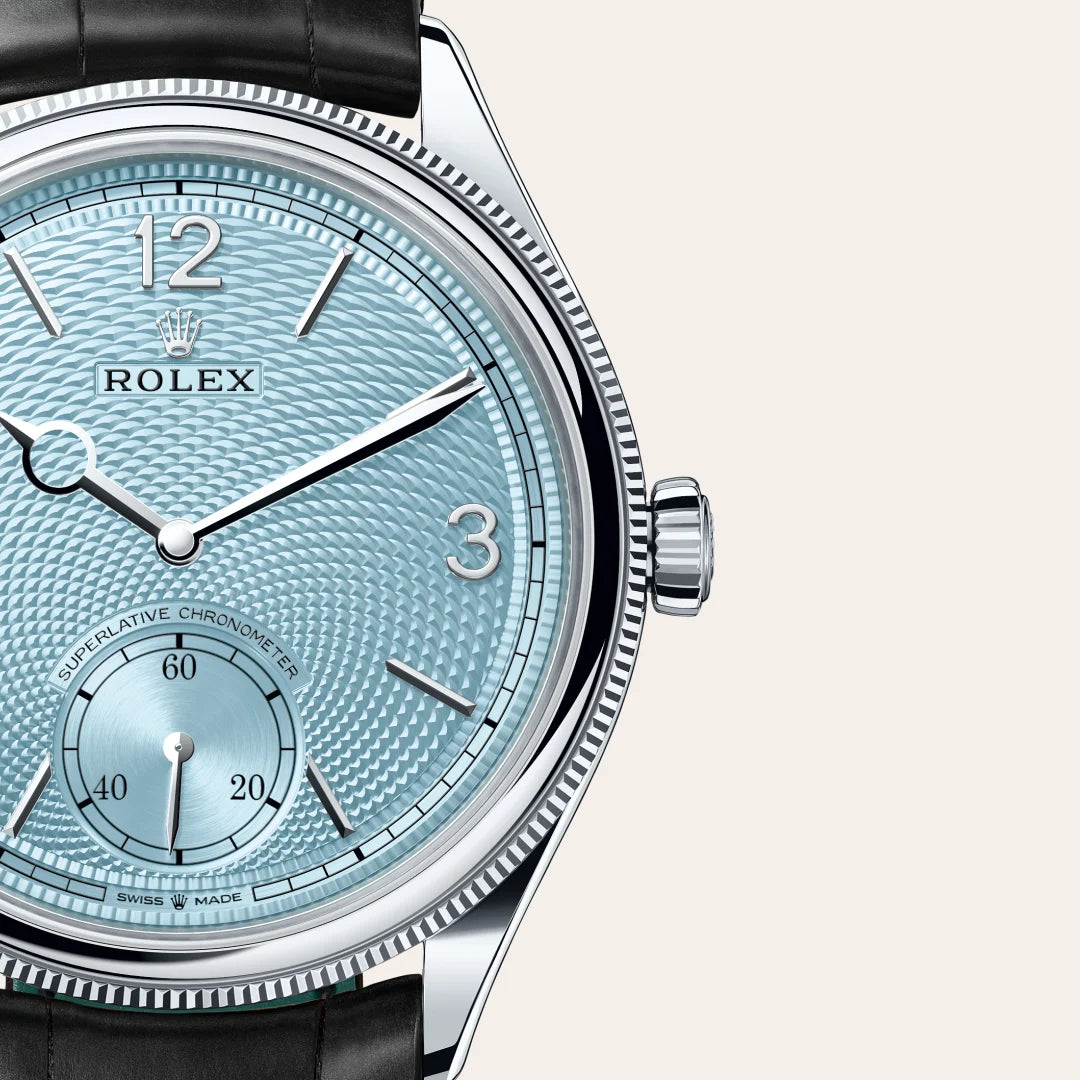 Rolex 1908 in Platinum with a Ice blue, rice-grain motif dial, Domed and fluted bezel, Leather strap bracelet