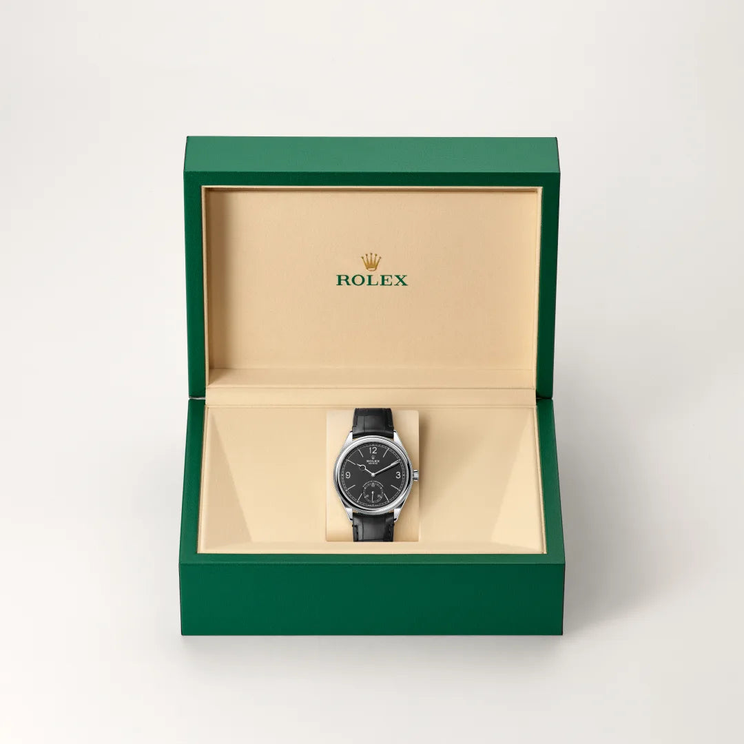 Rolex 1908 in 18 ct white gold with a Intense black dial, Domed and fluted bezel, Leather strap bracelet