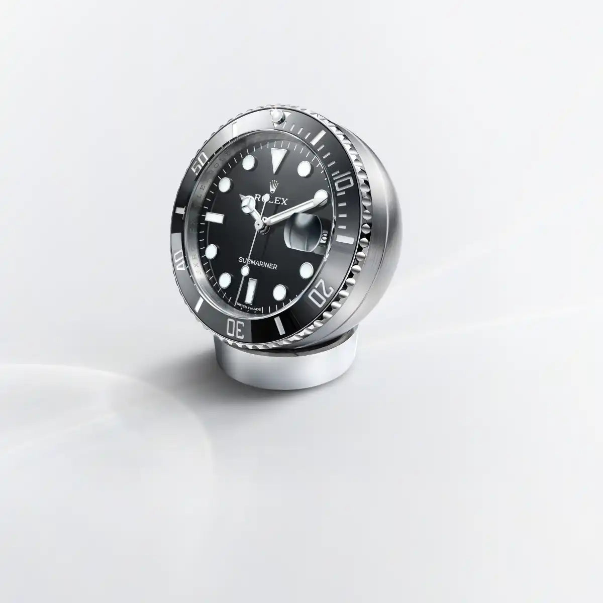 Rolex Submariner Date desk clock in Stainless steel with a Black lacquer dial, Fixed 60-minute graduated, scratch-resistant Cerachrom insert in black ceramic bezel, c909010ln-0001 at Lister Horsfall