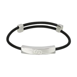 Gucci Tag Bracelet with a interlocking GG and leather strap.